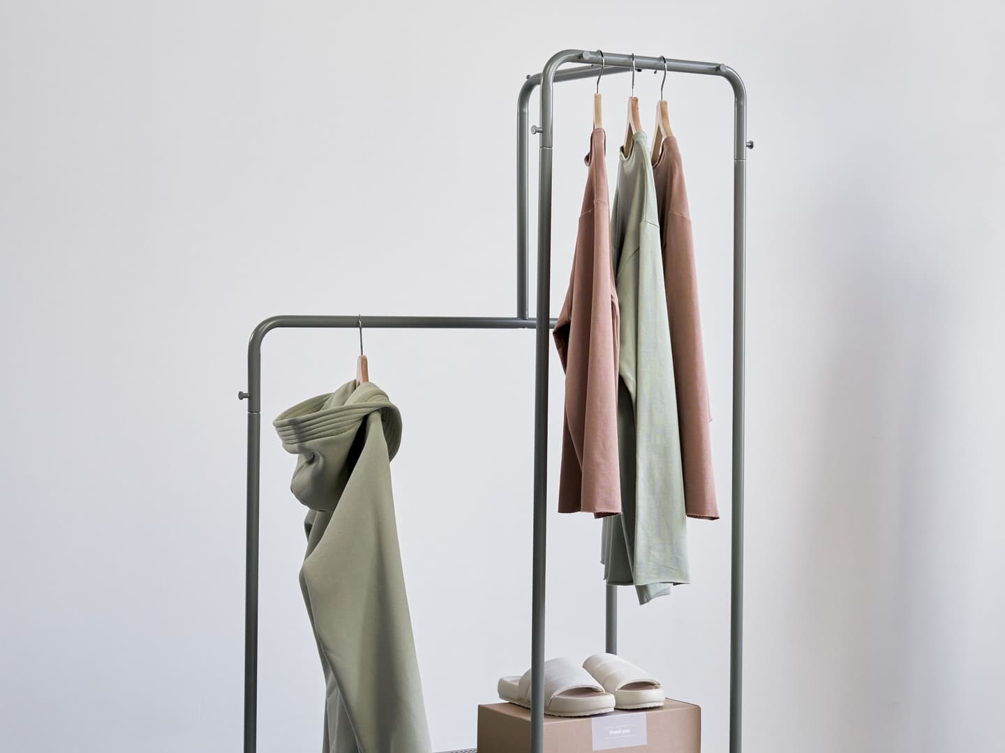 Minimalist garment rack in a bright studio